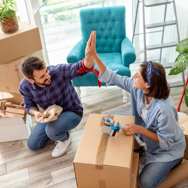 a couple packing up their home before it's cleaned by Abby's Cleaning Service's move-in/move-out cleaning service